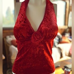 Get ready for the holidays in this crushed velvet red halter top by Cache.